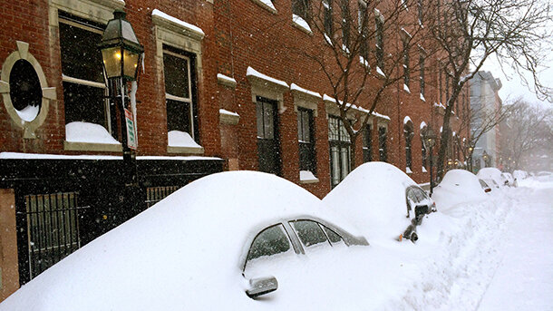 Photo depicting deep snow over cars along a Boston street on January 27, 2015