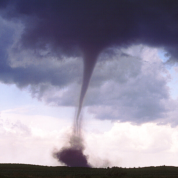 Photo depicting an example of a tornado that has touched down