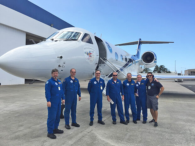 Picture of the NOAA Gulfstream aircraft which flew 23 research missions during ENRR and its crew.