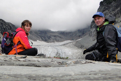 Jill and Mauri Pelto seated on a glacier 