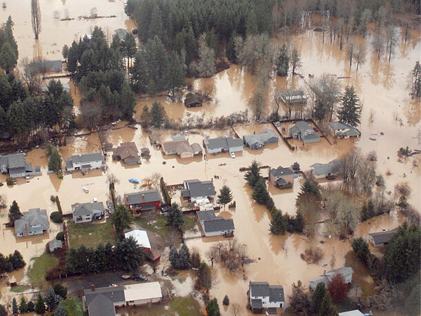 Aerial photo of flooded neighborhood in Oregon showing standing muddy water around houses