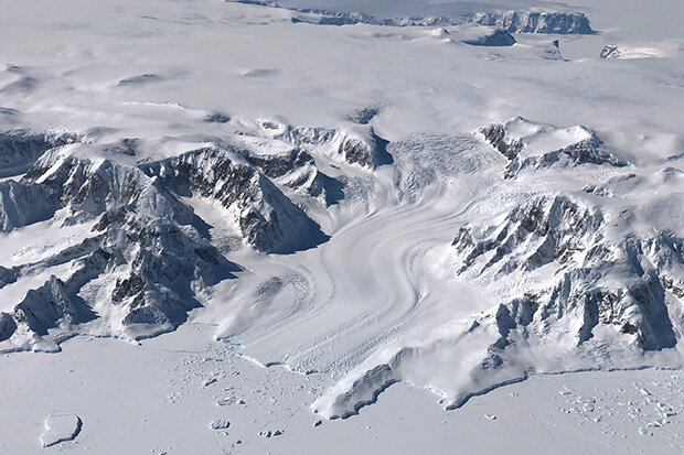aerial photo of a glacier flowing off the West Antarctic Ice Sheet into the Bellinghausen Sea
