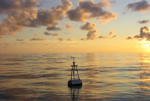Ocean buoy in low-angled sunlight