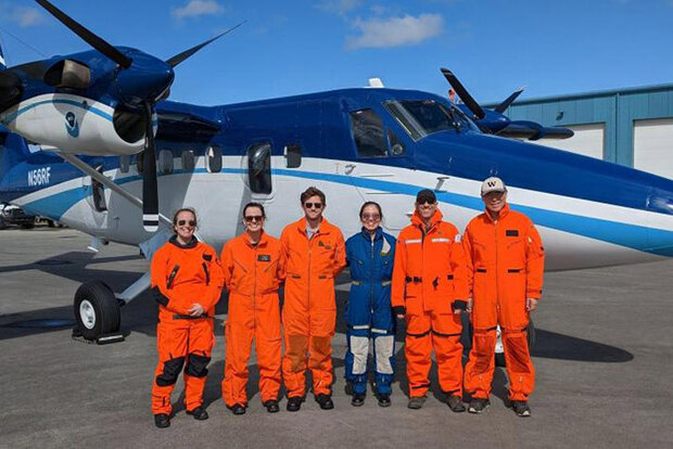 Research crew with plane