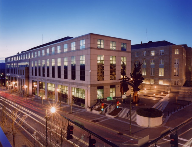 Modern building with tall windows at twilight