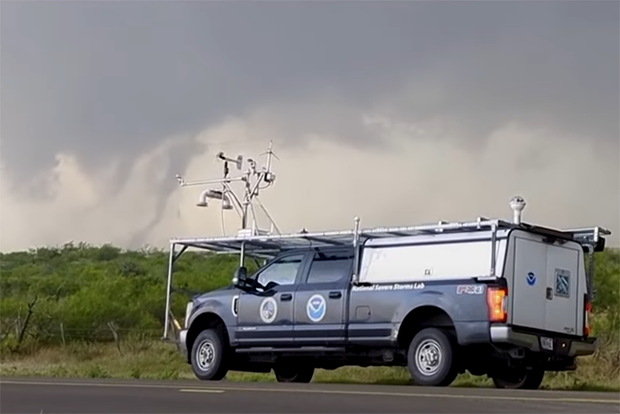 NOAA research truck with tornado in background