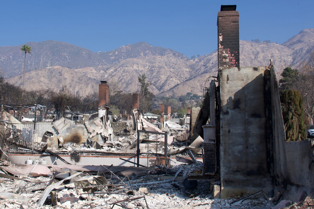 a line of chimneys from burned homes